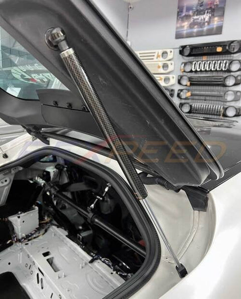 Rexpeed Carbon Fiber Rear Trunk Gas Strut Dampers | 2020-2026 Toyota Supra GR (TS120)